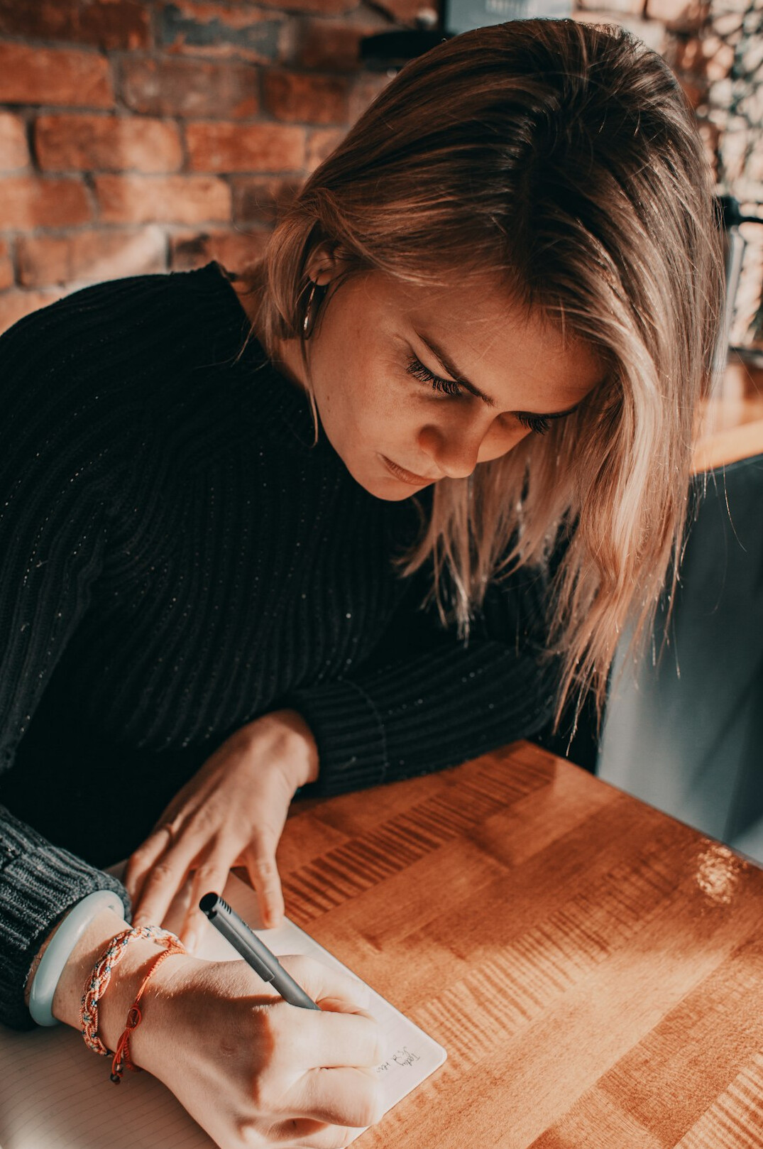 person taking notes in notebook