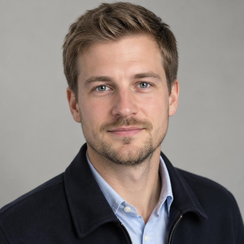 Portrait of a man with light stubble and short hair