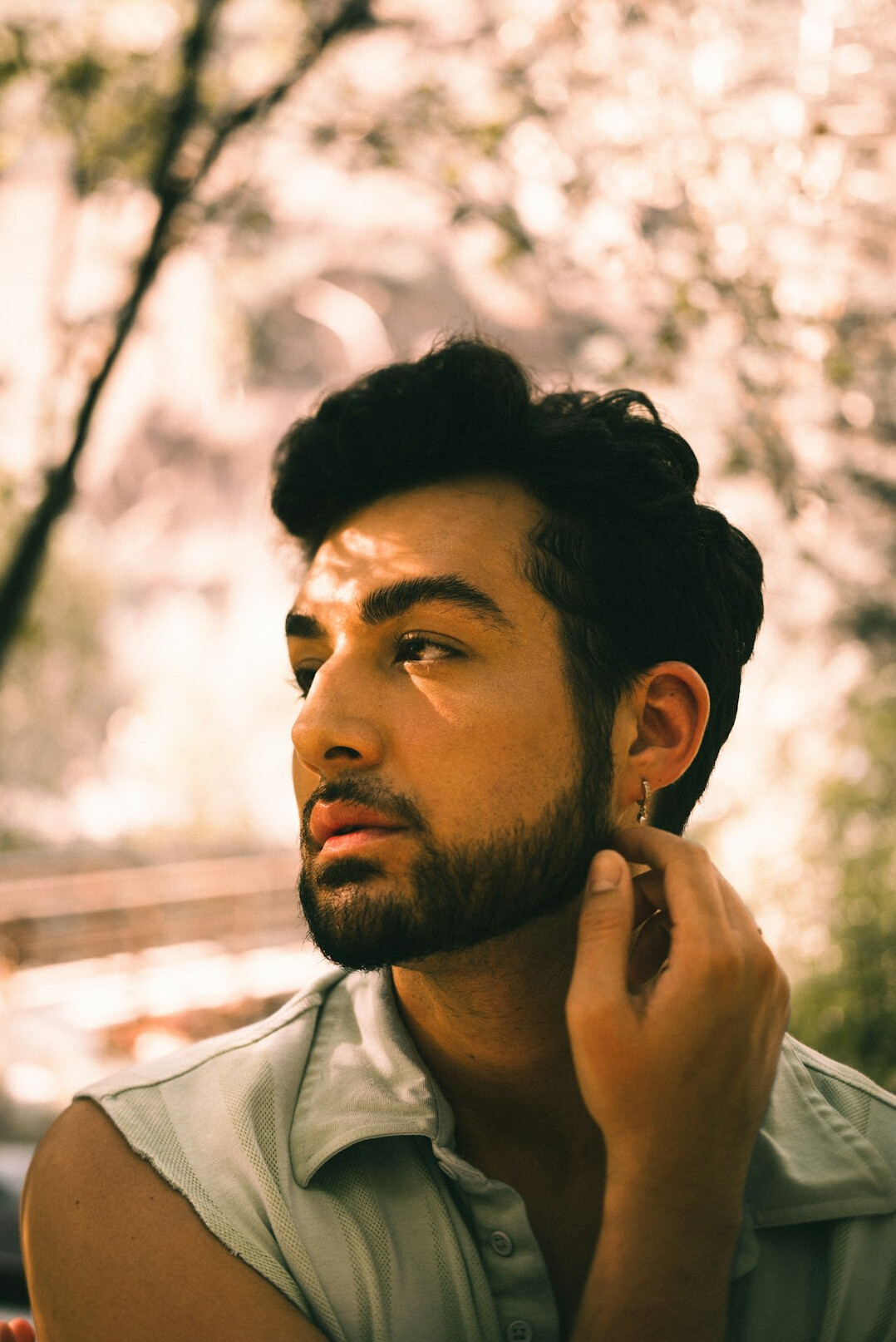 Portrait of a man with short dark hair and a beard